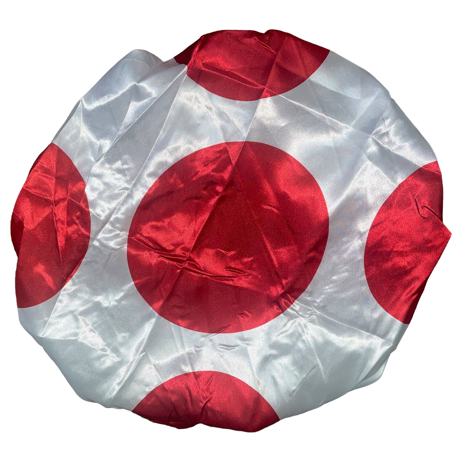 Round object with red and white pattern on a white background