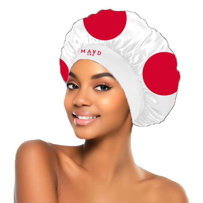 Woman wearing a white bonnet (hair net) with red dots and 'Maya' branding on a white background